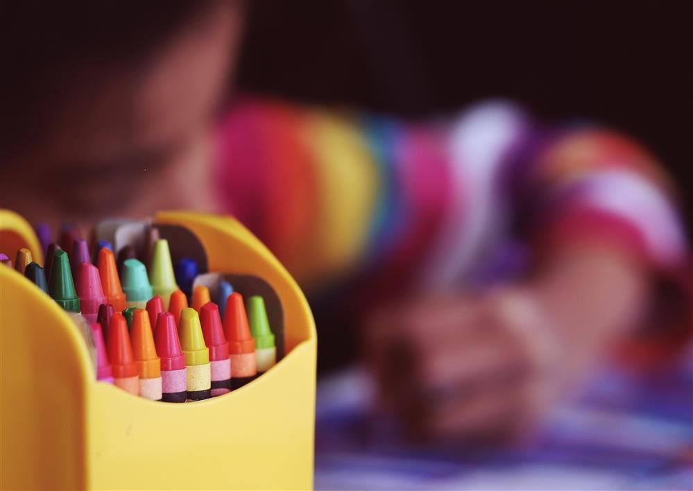  Crayons and a child coloring 